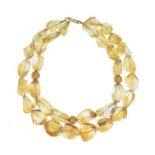 A double row of citrine beads,