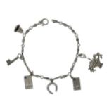 A charm bracelet with diamond set charms,