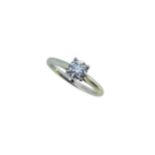 A modern platinum diamond solitaire ring,