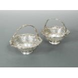 Dublin - A pair of (possibly) George III silver swing handled bon bon dishes,