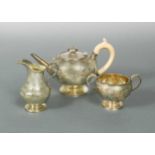 A Victorian silver gilt three-piece bachelor's tea set,