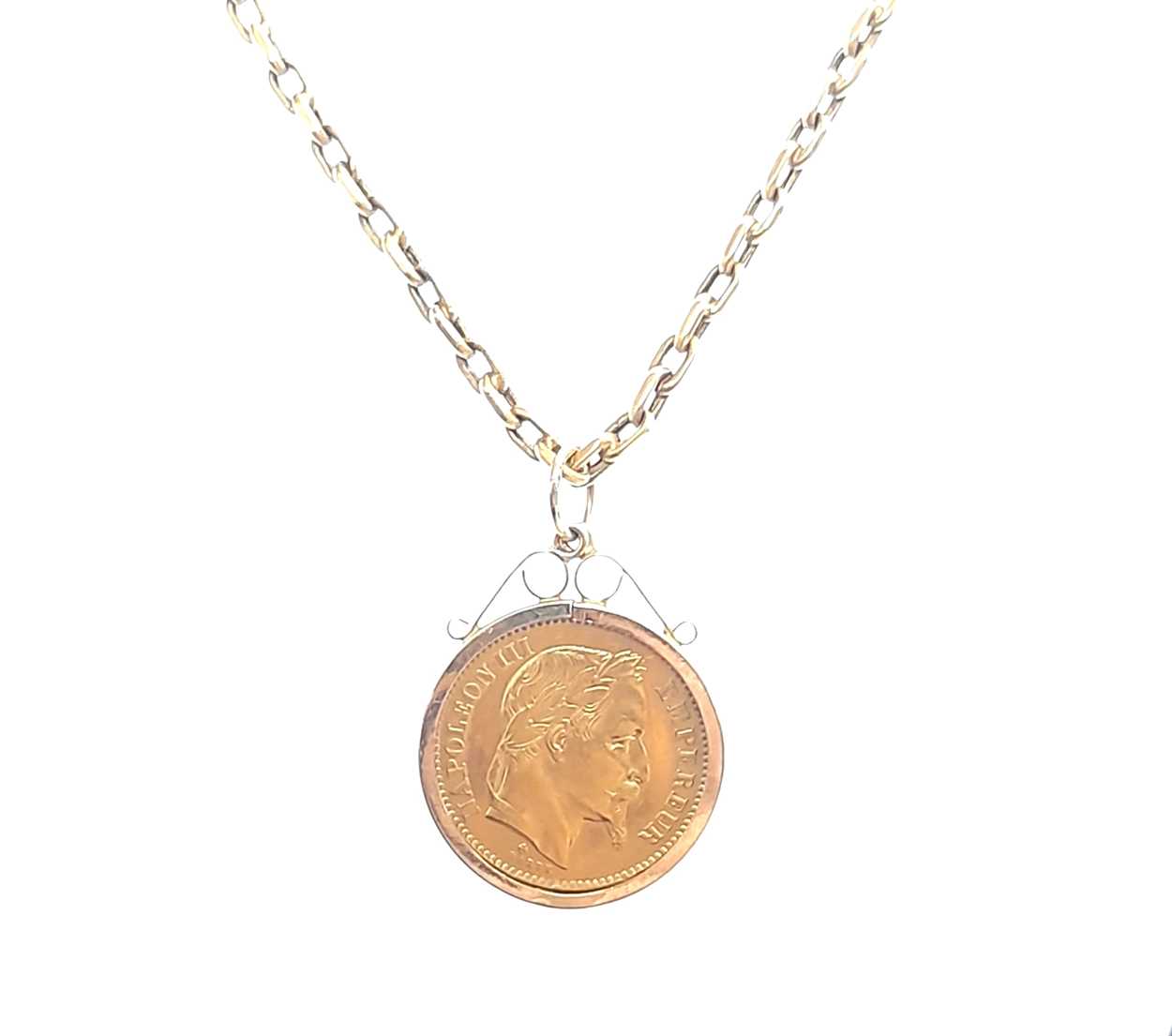 A 20 French Franc gold coin and chain,