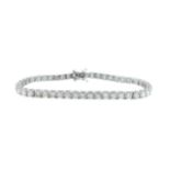 An 18ct white gold diamond line bracelet,