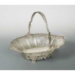 An early George III 18th century silver swing handled cake basket,