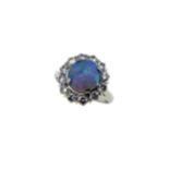 A black opal and diamond cluster ring,