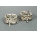 A pair of early Victorian cast silver salts,