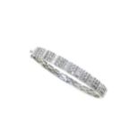 A modern half set diamond bangle,
