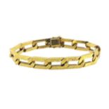 Cartier - An 18ct gold curb link bracelet,