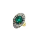 An emerald and diamond cluster ring,