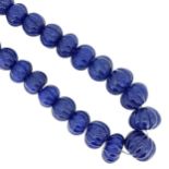 A single row of carved sapphire beads,