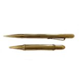 Two 9ct gold propelling pencils,