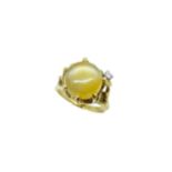 A cat's eye quartz and diamond dress ring,