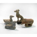 A group of four Chinese pottery animal figures, Han/Tang Dynasty,