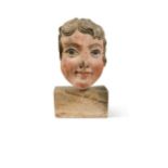 A Continental carved and painted wood head, 18th/19th century,