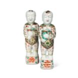 A Pair of Chinese famille verte porcelain standing smiling boys, Qing Dynasty, Kangxi (1662-1722),