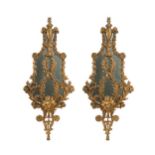 A pair of carved giltwood and painted wall mirrors, 20th century,