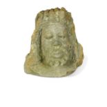 A carved stone mask of a bearded man, possibly 19th century or earlier,