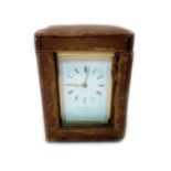 A late Victorian polished brass cased carriage clock,