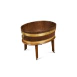 A George III mahogany and brass bound oval wine cooler,