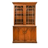 A Victorian pitch pine gothic cabinet,
