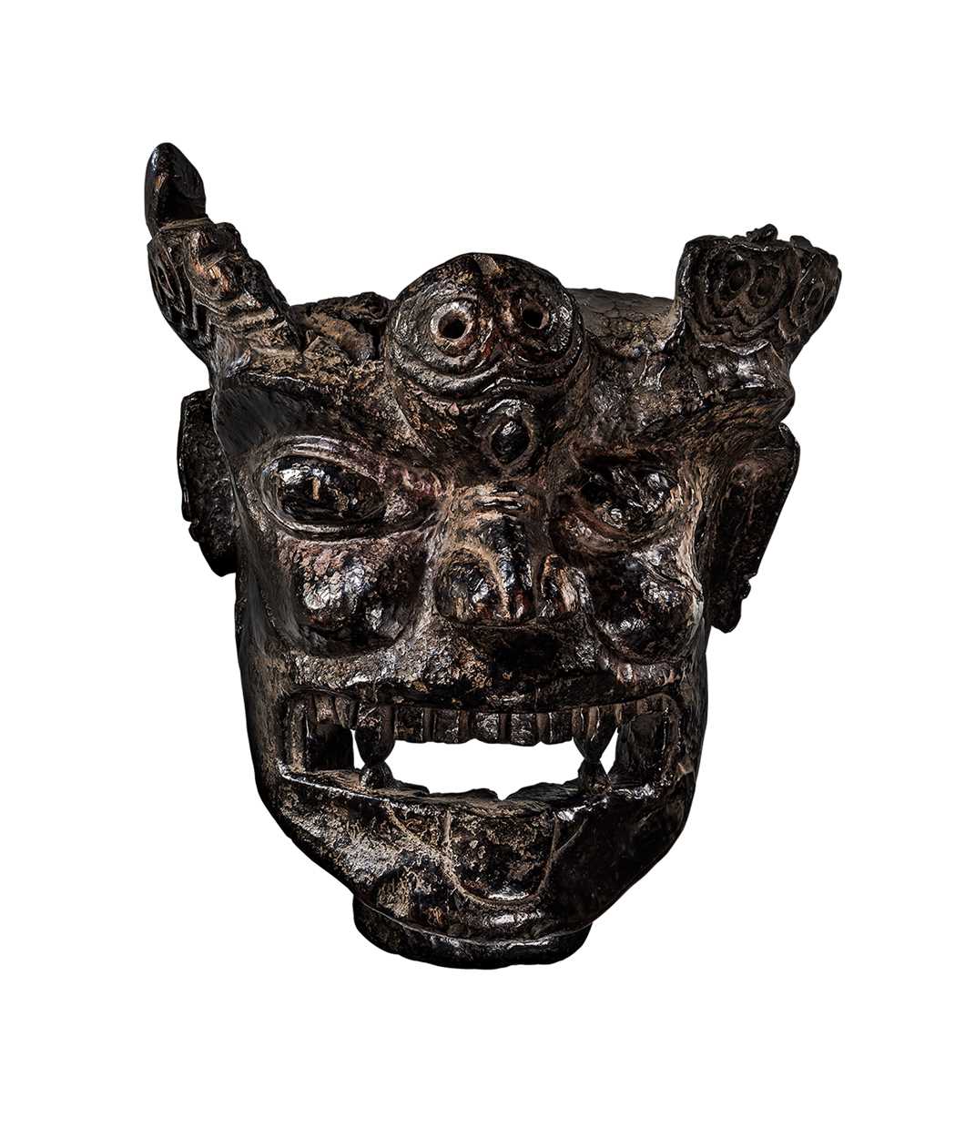 A rare and important carved wood mask of Krodha, Southern Tibet, carbon dated AD1430-AD1620,
