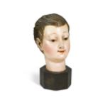 A Spanish polychrome painted carved wood head of a boy, 19th century,