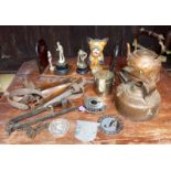 A brass mounted book stand, vintage ice skates, trophy, badges, two copper kettles, animal trap, dog