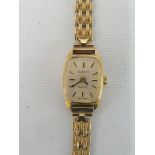 A cased 9ct gold Everite lady's wristwatch on a 9ct gold strap, approx. 12g.