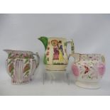 A 19th Century Sunderland lustre jug, one other plus a Staffordshire jug depicting a lady and