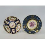 A Royal Worcester bowl, blue and gilded border with central mauve floral spray, 7 3/4" diameter,