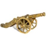 A brass model cannon, 11" long.