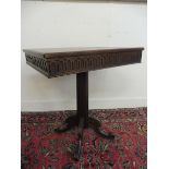 An unusual oak rectangular centre table raised upon a part reeded stem to four swept supports, 29" w