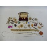 A small box of mixed earrings, rings etc. including a yellow metal pendant set with a central