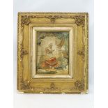 A 19th Century gilt framed silk embroidered study of an Eastern girl sat beside a basket of flowers,