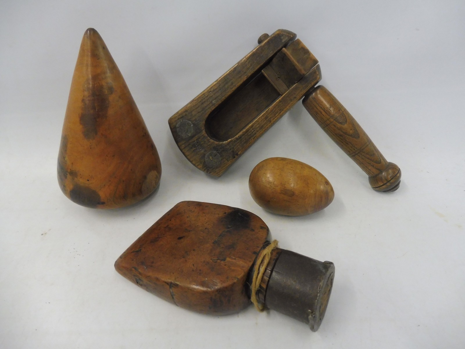 A Victorian ash bird scarer, a sailor's fruitwood sail rubber, a lignum turnpin and a treen egg. - Image 2 of 2