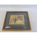 A framed and glazed watercolour of a lady, head and shoulders, possibly French, signed top right