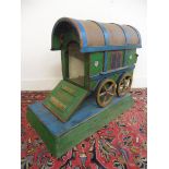 An unusual painted wooden dog kennel in the form of a gipsy caravan, 33" w x 25 1/2" h x 18 1/4" d.