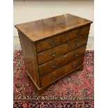 An 18th Century walnut chest of four long drawers, with crossbanded top and bracket feet, 34 3/4"