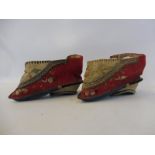 A pair of miniature silk and embroidered Chinese shoes.