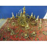 A large and impressive 18 branch brass chandelier.