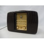 A crocodile leather covered Ultra Twin-De-Luxe radio, unusually with sliding front doors.