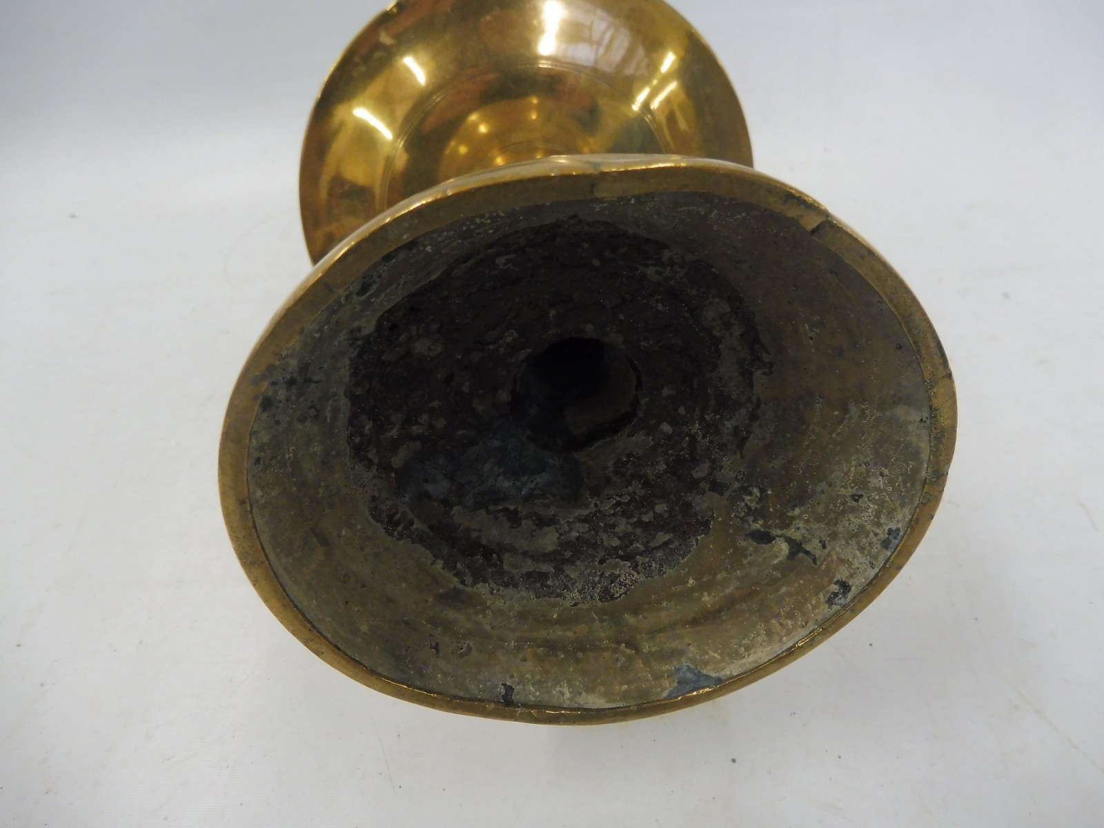 A 17th Century Dutch West Indies brass pricket candlestick with a broad mid drip pan, 11" long. - Image 3 of 5