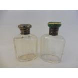 A good quality glass dressing table bottle with a silver and shagreen lid, plus a second bottle with