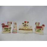 A pair of miniature 19th Century Staffordshire spaniels, a swan spill vase etc.