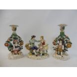 A pair of Sitzendorf porcelain floral encrusted figures 7" h plus a Continental porcelain group.