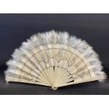 An ivory 16 section fan with embroidered silk and feathers.