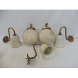 Two spherical opaque glass wall lights with brass fittings plus three wall lights with white
