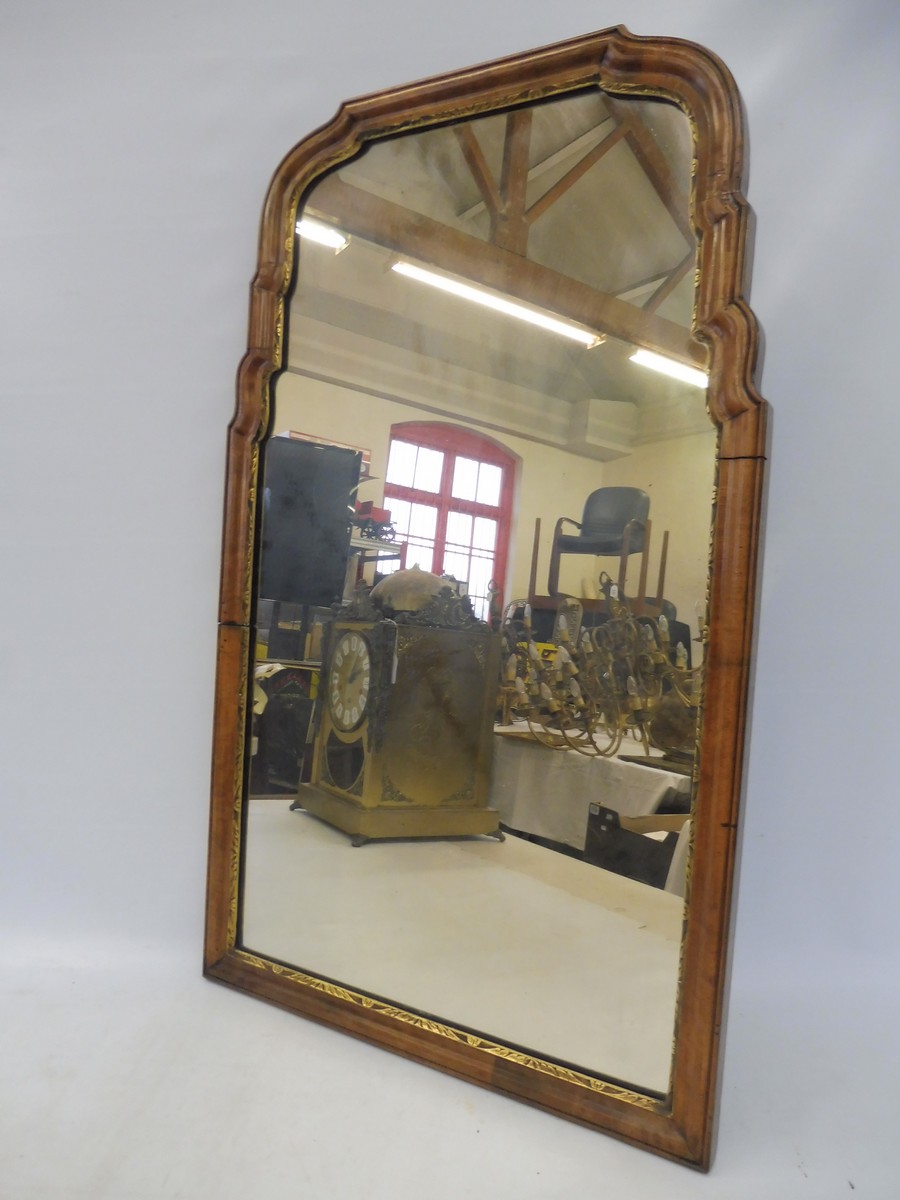 A walnut framed wall mirror, probably 18th Century, with paper label to verso for Tredegar Park,