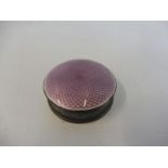 A silver and mauve enamel circular pill pot.