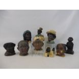A collection of seven late 19th Century/early 20th Century terracotta and porcelain tobacco jars,